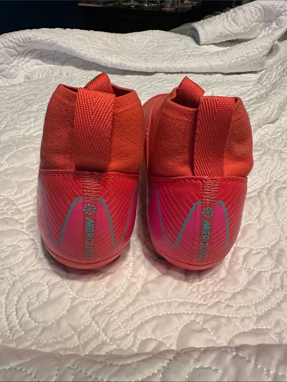 Nike Kids Red Soccer Cleats with Teal Swoosh